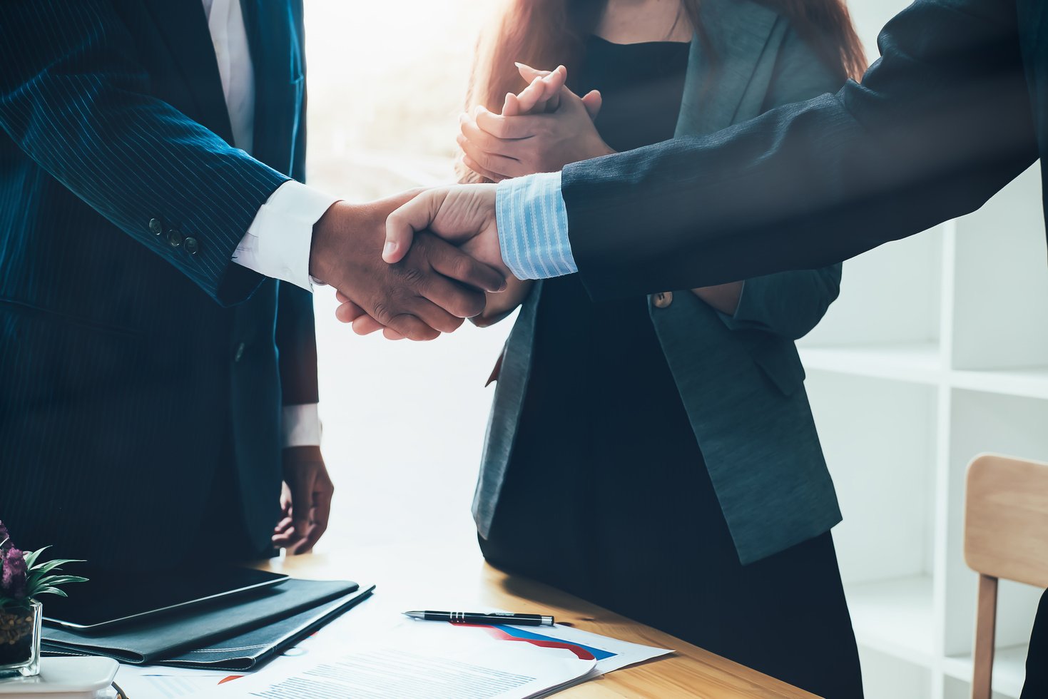 Handshake Between Business People in an Office